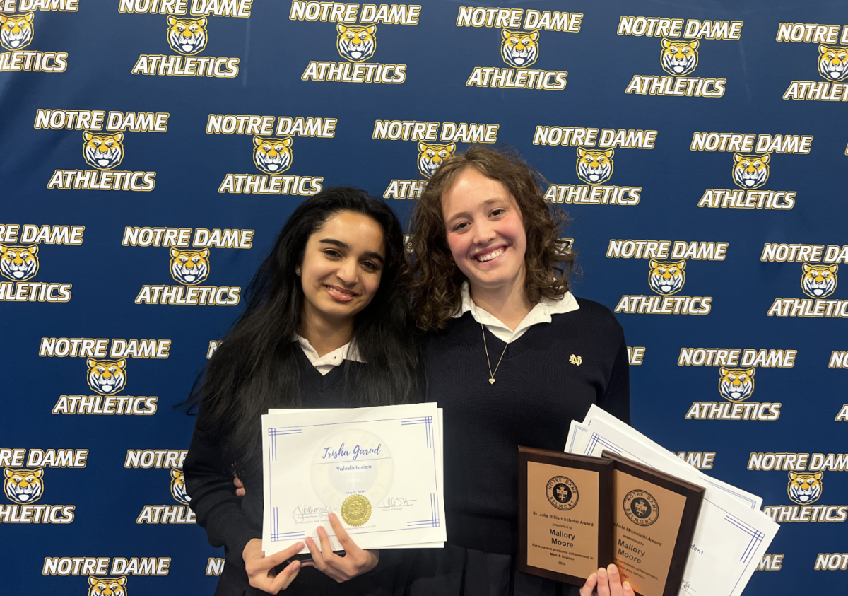 Garud and Moore celebrate after receiving their awards during the 2024 Academic Awards Night.